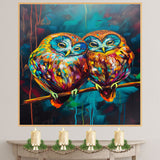 Vibrant Owl Pair Artwork Featuring Multicolor Plumage and Large Blue Eyes Perched on a Branch with Rich Abstract Background in Teal Red and Yellow Accents on Ready to Hang 1.5" Thick Canvas Wrap, Floating Framed Canvas, Flat Rolled Canvas